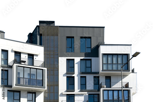 Modern apartment complex facade shows varied geometric volumes. Contemporary architecture displays windows balconies creating urban composition. Real estate concept housing development city
