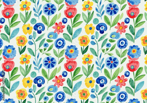Small multicolored blossoms forming a seamless pattern creating a lively and bright floral surface