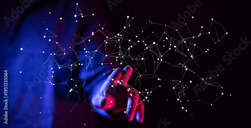 Abstract futuristic image of a hand touching a network of connected nodes representing data communication and the futur