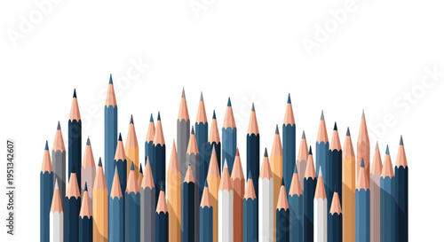 Assorted collection of sharp wooden pencils in various shades of blue and cream stand together on a white background.