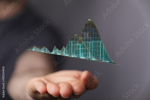 A person holds a digital gr...