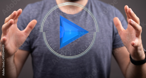 A man's hands frame a blue ...