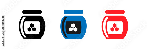 Differently colored jars with leafy green tops