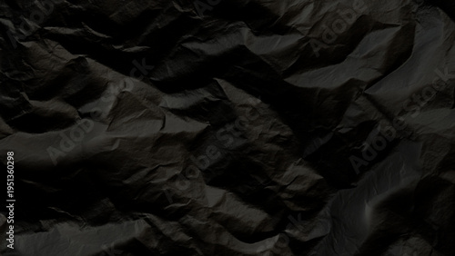 Dark crumpled paper texture background with deep shadows and creases