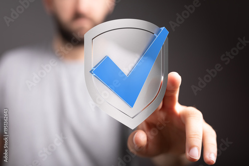 Hand touching a shield icon...