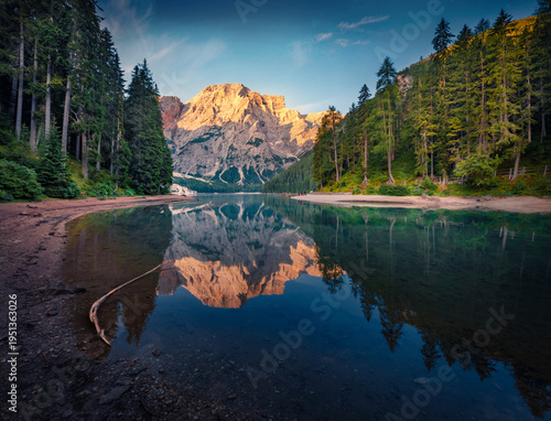 Exciting morning view of Braies (Pragser Wildsee) lake. Superb summer sunrise in Fanes-Sennes-Braies national park, Dolomiti Alps, South Tyrol, Italy, Europe. Beauty of nature concept background.