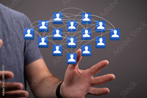 Hand holding a network of p...