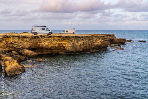 Camper vans on the cliffs of Lido Costanza in Mazara del Vallo, Sicily