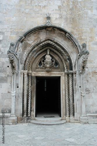 Photography The ornate gothic entrance of Saint Marks Cathedral features stone lions and a s