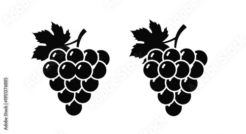 Two bunches of grapes depicted in a striking black silhouette