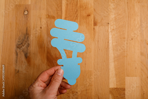 Hand holding a paper lightb...
