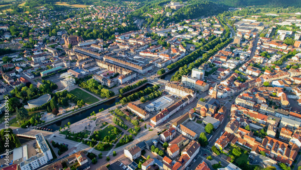 Fototapeta premium Aerial view of the old town above the city of Saint-Die-des-Vosges in France, on a sunny spring afternoon.