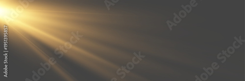 Cinematic anamorphic golden lens flare with soft volumetric glow on dark