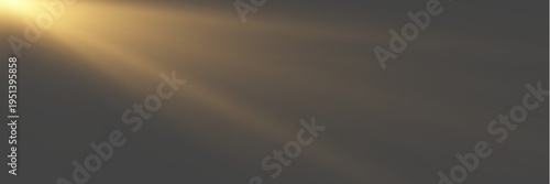 Cinematic anamorphic golden lens flare with soft volumetric glow on dark