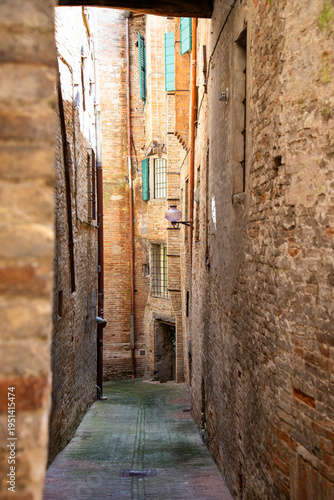 Traditional narrow street in Urbino, Italy.
