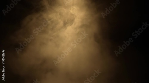 Soft and diffused cloud-like forms floating against a dark backdrop