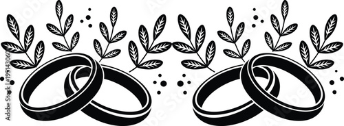 Elegant wedding rings surrounded by delicate leafy branches and small dots