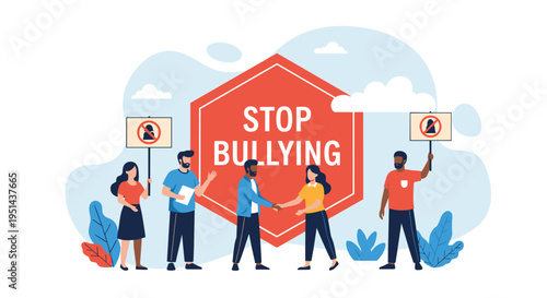 Group of people stands in front of a stop bullying sign advocating for kindness and end of harassment.