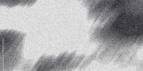 Abstract monochromatic background with soft, diffused dark cloud-like formations and a fine grainy texture on a speckled white surface for atmospheric and artistic design elements