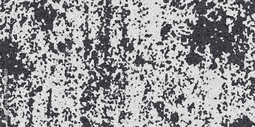 Abstract monochrome speckled texture with irregular dark gray splotches and a fine granular overlay, creating a distressed and organic surface effect for backgrounds