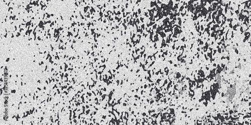 Abstract monochrome textured background with irregular dark splotches and fine granular noise creating a distressed and organic surface pattern for artistic use