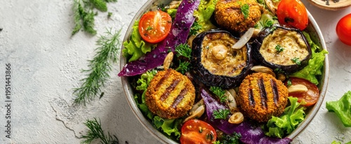 Fresh, colorful salad with grilled eggplant, falafel, and vegetables