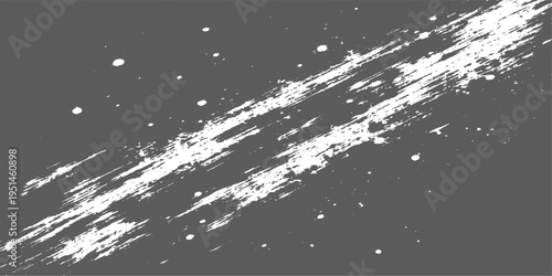 Abstract white paint brush strokes and splatters on a dark gray background for artistic texture