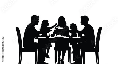 Family dinner scene with parents and children a striking silhouette