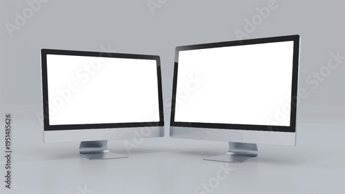 Two modern computer monitors angled towards each other with blank white screens with empty screens with computer setup