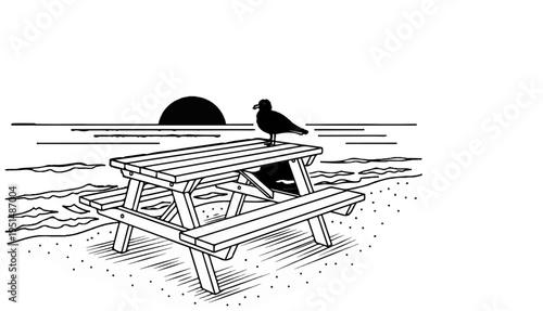 Bird perches on a picnic table at the sandy beach with ocean sunset backdrop