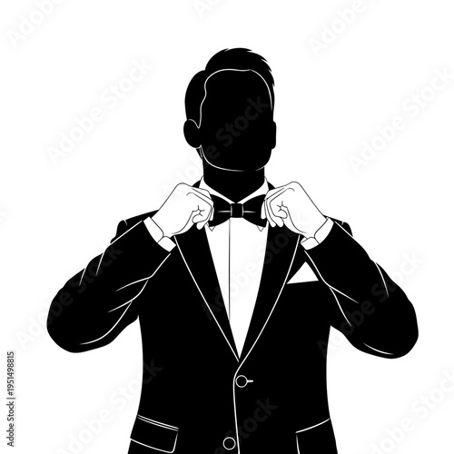 Man in black tuxedo adjusting bowtie.