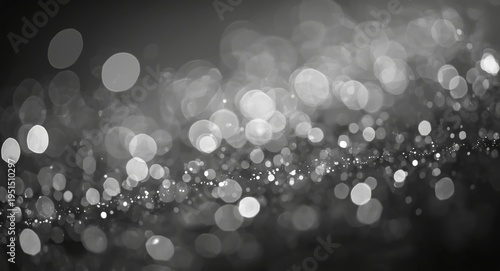 Abstract grey bokeh circle texture background with shimmering particle highlights