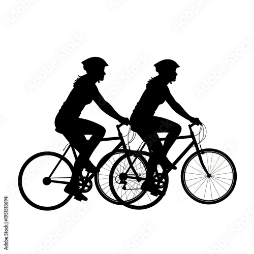 Two cyclists riding bicycles together fast.