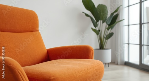Clean minimalist living room accented with closeup of orange lounger