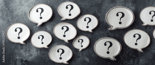 Outlined paper speech balloons filled with question marks for FAQ presentation