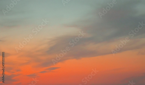 Clear blue sky with white clouds and airplane vapor trail