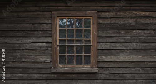 Simple wood framed window on an old weatherboard wall structure