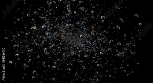 Isolated black pepper seeds floating and bursting in abstract motion