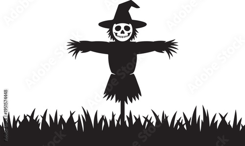 Black scarecrow with skull face and witch hat in grass