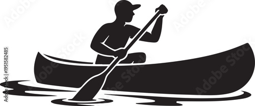Black silhouette of man rowing canoe on water