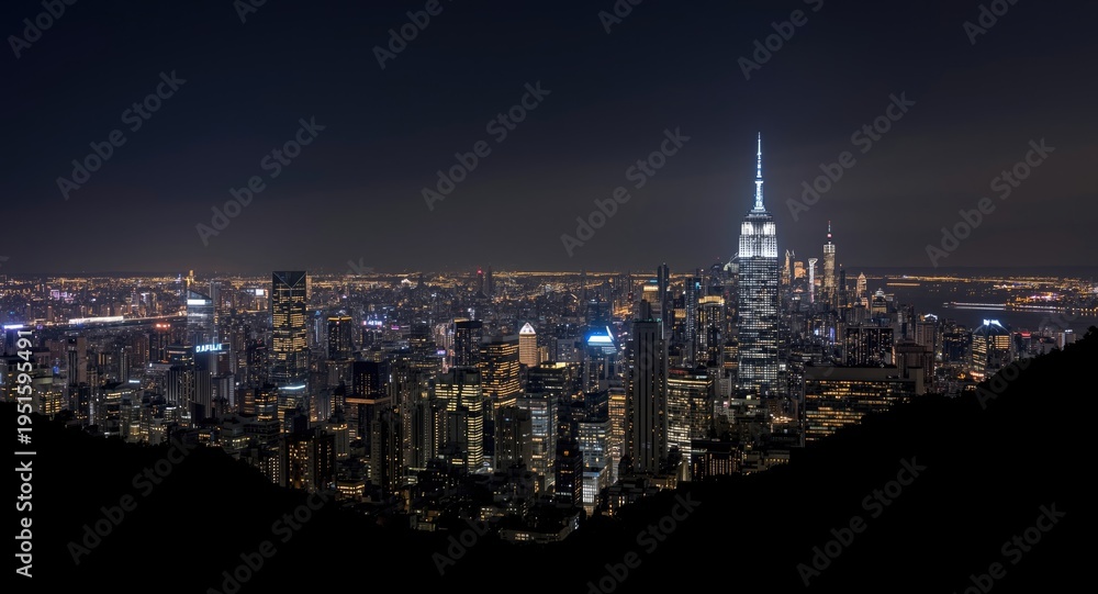 Fototapeta premium illuminated urban skyline with sparkling lights at night