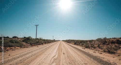 remote sandy road under bri...