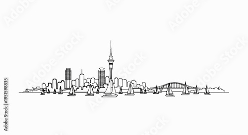 City skyline silhouette with a tall tower, bridge, and sailboats on the water