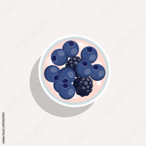 Top view of a healthy yogurt bowl with fresh strawberries, blueberries, and raspberries.