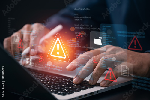 Cybersecurity threat warning concept with developer analyzing system code on laptop while digital alert icon highlights network security risk data breach detection and cyberattack protection.