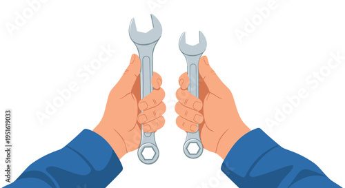 A pair of hands in blue long-sleeved shirts is firmly holding two identical silver open-end wrenches.