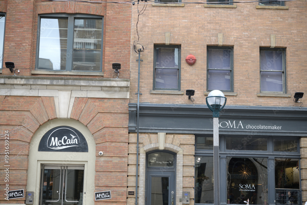 Fototapeta premium exterior building facade and sign of McCain Foods Limited (439 King W) and SOMA Chocolatemaker (443 King St W), Toronto