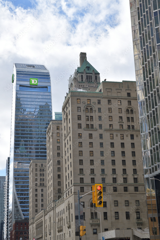 Obraz premium TD Terrace corporate office tower with skyline logo and historic Fairmont Royal York hotel, looking west on Front St W and Bay St, Toronto