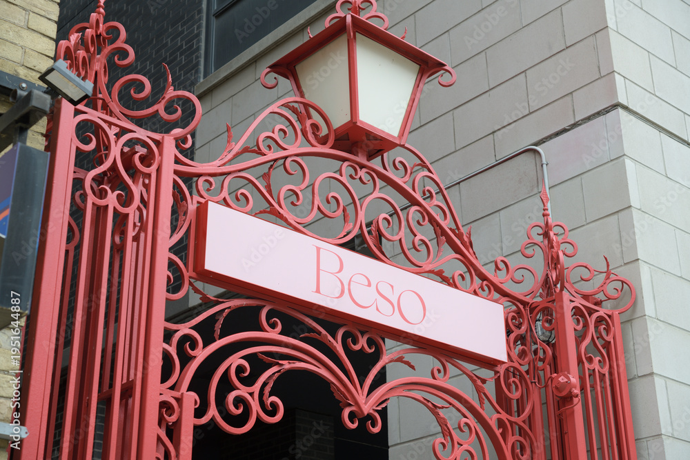 Obraz premium elegant gate with sign of Beso by Patria, a Spanish restaurant, located at 478 King St W, Toronto