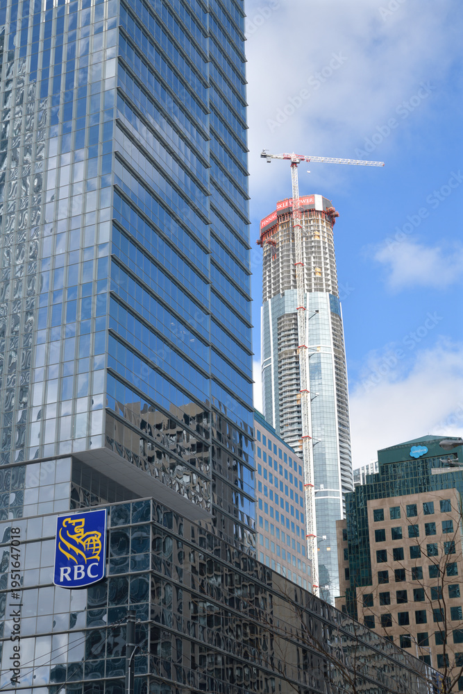 Obraz premium looking east on Queens Quay W to RBC WaterPark Place, Waterpark Place, and SkyTower Pinnacle One Yonge St, Toronto
